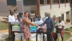 Maria Kivivuori, Acting Proprietress thanks West Hills Mall Manager, Eric Koranteng for the donation