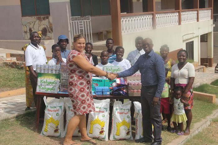 Maria Kivivuori, Acting Proprietress thanks West Hills Mall Manager, Eric Koranteng for the donation