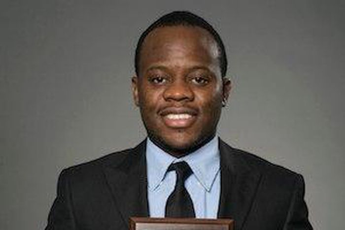 Adolph Okine, Ph.D. Student in Actuarial Science, Risk Management, and Insurance, holds his recent Best Paper Award.