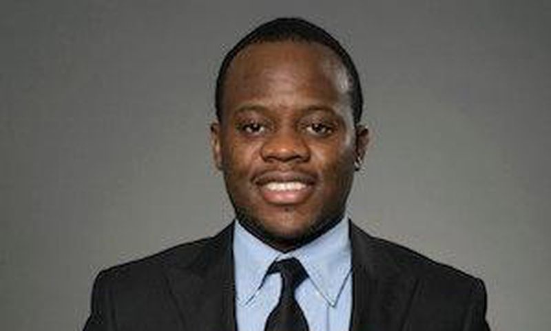 Adolph Okine, Ph.D. Student in Actuarial Science, Risk Management, and Insurance, holds his recent Best Paper Award.