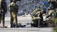 Palestinian shot dead after trying to stab Israeli soldiers - military