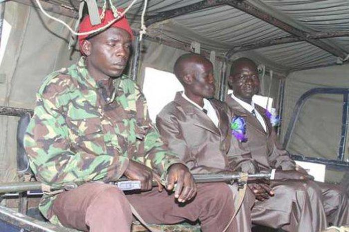 Charles Manoa (right) with his wedding best Man inside a police car after his wedding at Prebytterian Church Of East Africa Elburgon on November 29,2015 by a woman who claimed to be his legal wife and had two children with him
