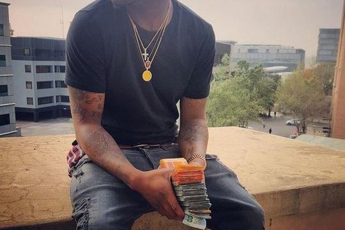 Davido with a stack of Rands