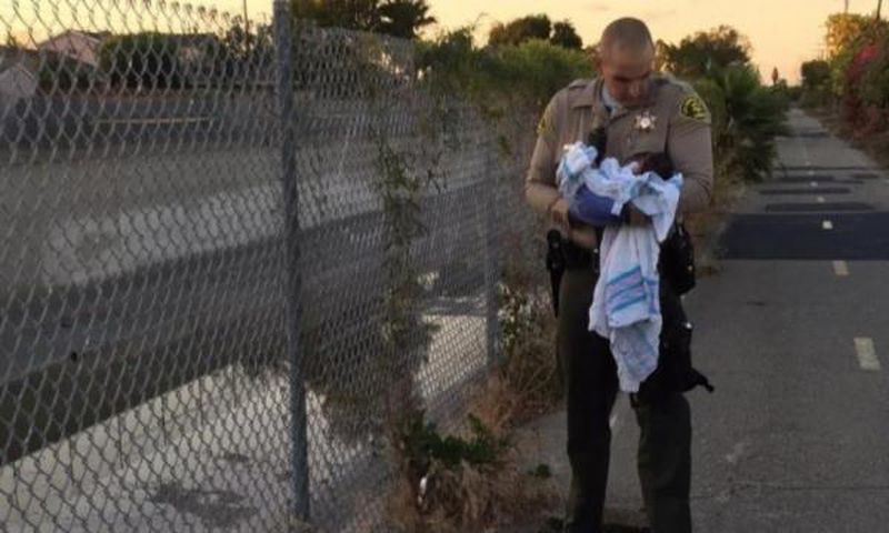 Newborn baby buried alive under road construction bitumen