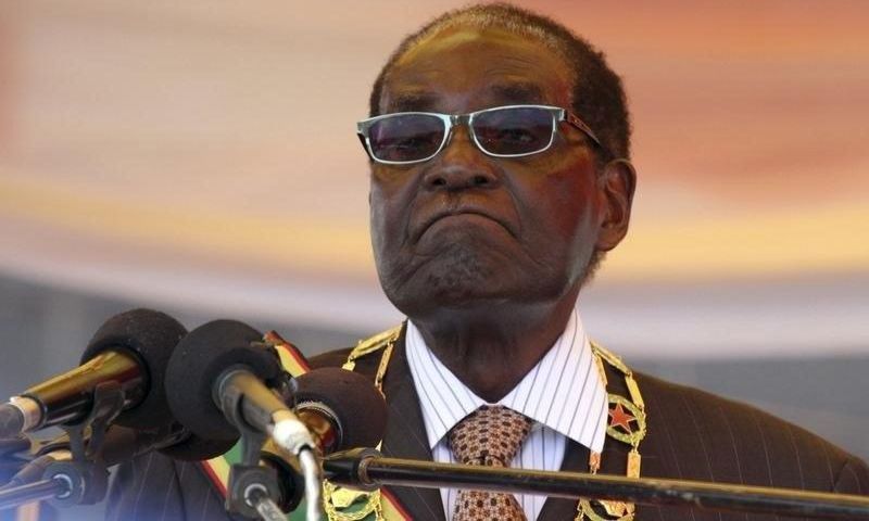 President Robert Mugabe waits to address crowds gathered for Zimbabwe's Heroes Day commemorations in Harare, August 10, 2015. REUTERS/Philimon Bulawayo