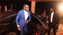 Prince David Osei stepping from a luxurious car