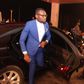 Prince David Osei stepping from a luxurious car