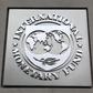 The International Monetary Fund (IMF) logo is seen at the IMF headquarters building during the 2013 Spring Meeting of the International Monetary Fund and World Bank in Washington, April 18, 2013. REUTERS/Yuri Gripas