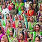 Indian diamond trader Mahesh Savani (top centre) wearing white, poses for a group photo along with brides before mass wedding hosted by him in Surat, India.