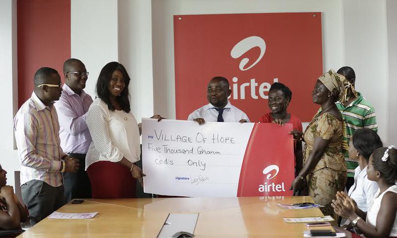 Hilary Denise Arko-Dadzie (3rd from left), from Airtel Ghana making the presentation to Mr. Kwaku Sarkodie, representative of Village of Hope Orphanage