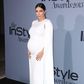 Kim Kardashian shows off bump in white floor length Valentino cape dress