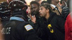 Rapper Vic Mensa confronts police during the protest