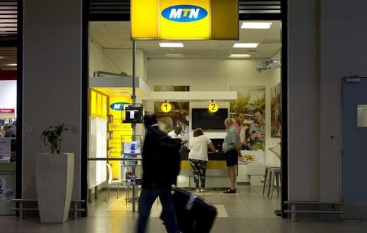 Travellers walk past an MTN telecom shop at King Shaka International Airport in Durban, South Africa, in a file photo. REUTERS/Rogan Ward