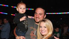 pregnant Tiffany Thornton and Chris Carney with their first son