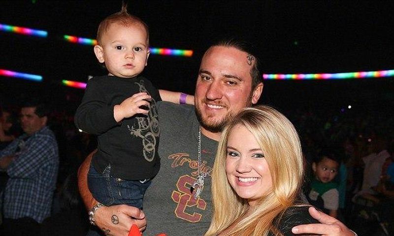 pregnant Tiffany Thornton and Chris Carney with their first son