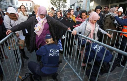 Brussels police detain two in raids linked to Paris attacks - prosecutor