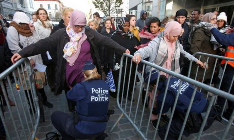 Brussels police detain two in raids linked to Paris attacks - prosecutor