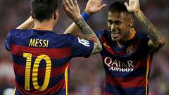 Barcelona"s Lionel Messi (L) celebrates with team Neymar after scoring a goal against Atletico Madrid during their Spanish first division soccer match at Vicente Calderon stadium in Madrid,12 September, 2015.