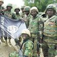 Nigerians soldiers destroy Boko Haram flag.