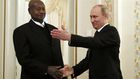 Russian President Vladimir Putin meets Uganda's President Yoweri Museveni