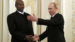 Russian President Vladimir Putin meets Uganda's President Yoweri Museveni