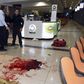 Israeli security personals stand next to blood on the floor, at the Beersheba central bus station where a Palestinian gunman went on a stabbing and shooting rampage, October 18, 2015.  REUTERS/Dudu Grunshpan