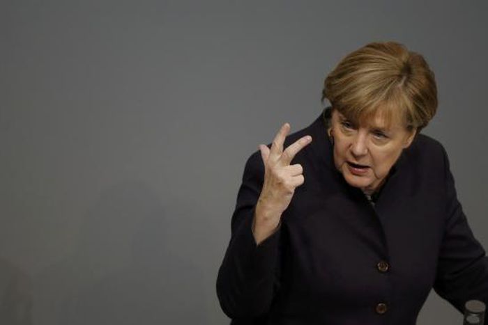 Defiant Merkel vows to stand by refugee policy despite security fears