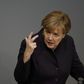 Defiant Merkel vows to stand by refugee policy despite security fears