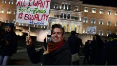 PHOTO: Members of the Greek gay, lesbian and transsexual community protested outside parliament ahead of the ruling(AFP: Louisa Gouliamaki)