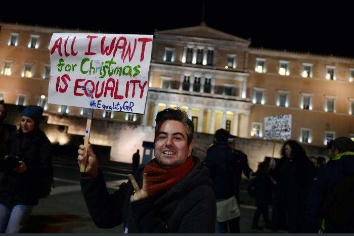 PHOTO: Members of the Greek gay, lesbian and transsexual community protested outside parliament ahead of the ruling(AFP: Louisa Gouliamaki)