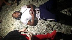 Floyd Mayweather sleeps on a bed of money