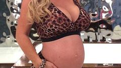 Coco austin shows off baby bump