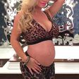 Coco austin shows off baby bump