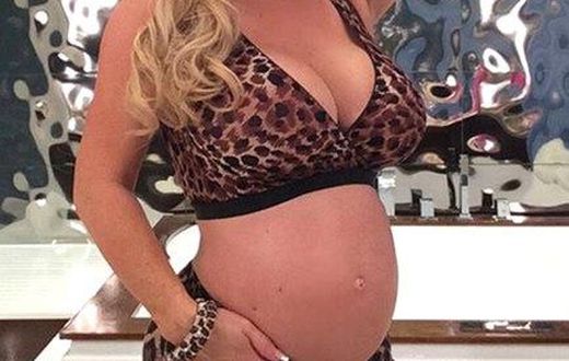 Coco austin shows off baby bump