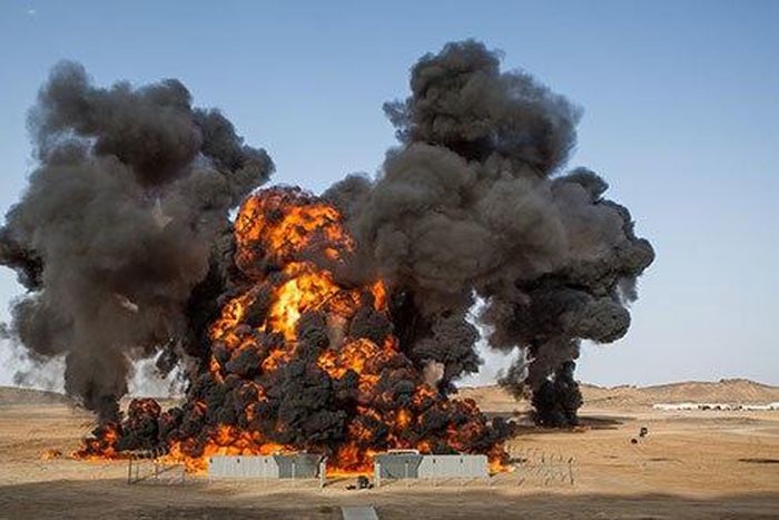 Four oil tanks on fire at Libyan ports after clashes with terrorists