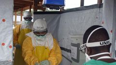 CDC Director Dr. Tom Frieden exits an Ebola treatment unit in West Africa in 2014.
