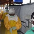 CDC Director Dr. Tom Frieden exits an Ebola treatment unit in West Africa in 2014.