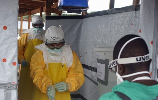 CDC Director Dr. Tom Frieden exits an Ebola treatment unit in West Africa in 2014.