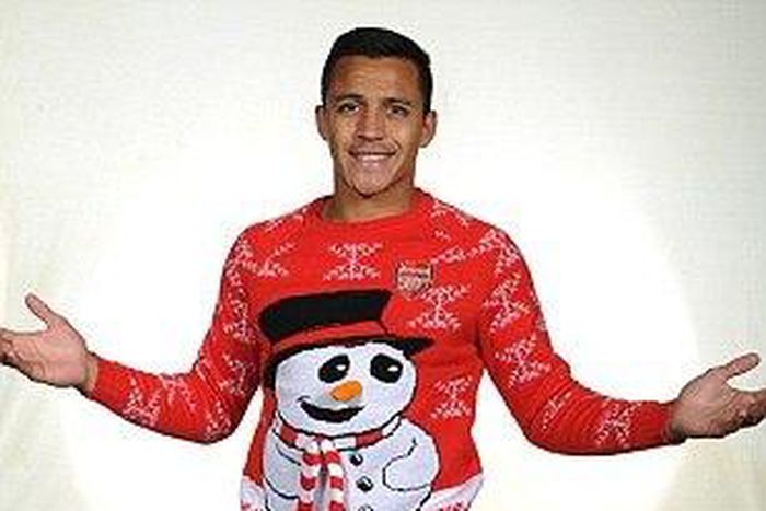 Alexis Sanchez models Arsenal Christmas jumper