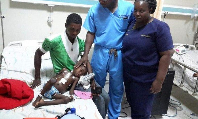 Dr Isaac Okyere attending to one of the seven children who underwent the open heart surgery