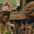 A scene from the movie [Abraham Attah and Idris Elba]