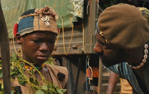 A scene from the movie [Abraham Attah and Idris Elba]