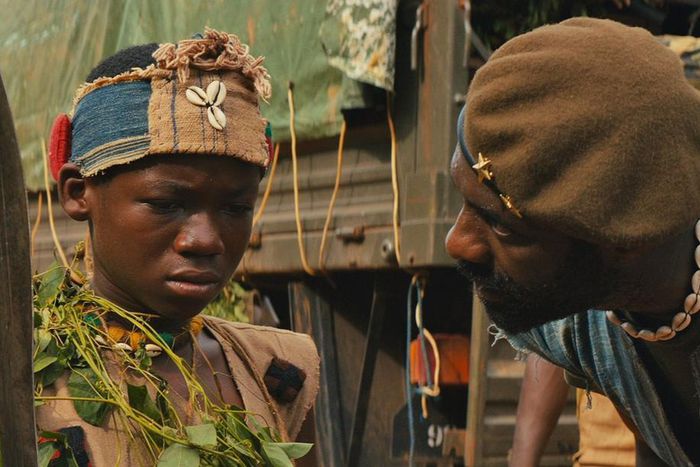 A scene from the movie [Abraham Attah and Idris Elba]