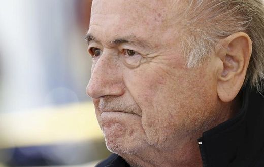 FIFA President Sepp Blatter reacts before the first game of the so-called "Sepp Blatter tournament" in Blatter's home-town Ulrichen, Switzerland, August 22, 2015. REUTERS/Denis Balibouse