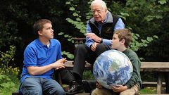 Jimmy Carter walks with his grandsons Jeremy Carter (R), 22, and Hugo Wentzel, 10 during a picnic event on October 31, 2009 in Istanbul, Turkey