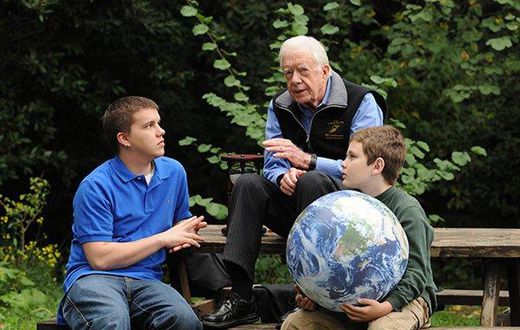 Jimmy Carter walks with his grandsons Jeremy Carter (R), 22, and Hugo Wentzel, 10 during a picnic event on October 31, 2009 in Istanbul, Turkey