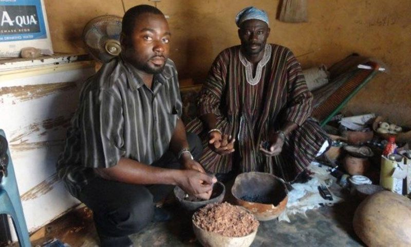 Stephen Awuni, CSIR Research Scientist, with a traditional herbal practitioner during an interview. In Ghana, around 70 percent of the population sees traditional medicine as a desirable and necessary means of treating problems that Western medicine ca...