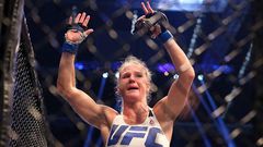 Holly Holm celebrates with her UFC belt after beating Ronda Rousey