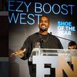 Kanye West receiving his award