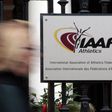 A woman walks past the IAAF (The International Association of Athletics Federations) headquarters in Monaco November 4, 2015. REUTERS/Eric Gaillard